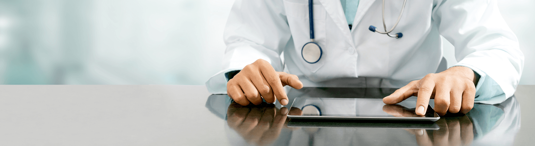A doctor using a tablet device.