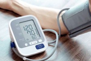 Arm with high blood pressure checker device.