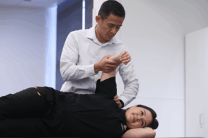 Osteopathic Manipulative Treatment An osteopathic physician manipulates a patient's arm.
